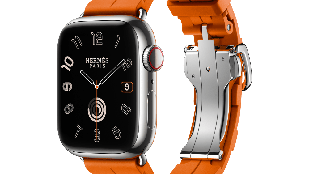 Apple Watch Series 9 and Hermès single-turn Kilim bracelet with Orange rubber folding clasp.
