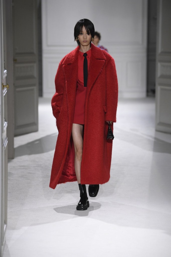 Model on the runway at Valentino's fall 2023 ready-to-wear show on March 5, red color fashion trends