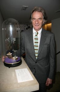 LONDON - JUNE 09:  Designer Paul Smith poses beside one of the exhibits on display in the 'My Most Treasured...' exhibition at Browns during the Private View on June 9, 2008 in London, England. The exhibition, showcasing treasured pieces of jewellery belonging celebrities from the fashion world, marks London's first ever fine jewellery week.  (Photo by Tim Whitby/Getty Images)