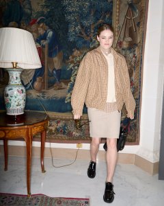 A look at Kristine Froseth getting ready for the Miu Miu Fall 2024 show.