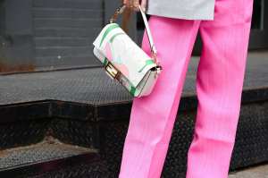 Leonie Hanne is seen wearing a Fendi bag, grey blazer and pink pants outside of the Ulla Johnson show on February 08, 2020 in New York City.