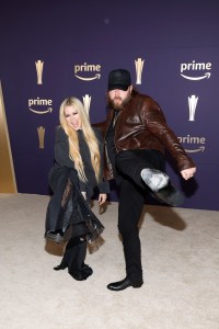 FRISCO, TEXAS - MAY 16: EDITORIAL USE ONLY. (L-R) Avril Lavigne and Nate Smith attend the 59th Academy of Country Music Awards at Omni Frisco Hotel at The Star on May 16, 2024 in Frisco, Texas. (Photo by Jason Kempin/Getty Images)