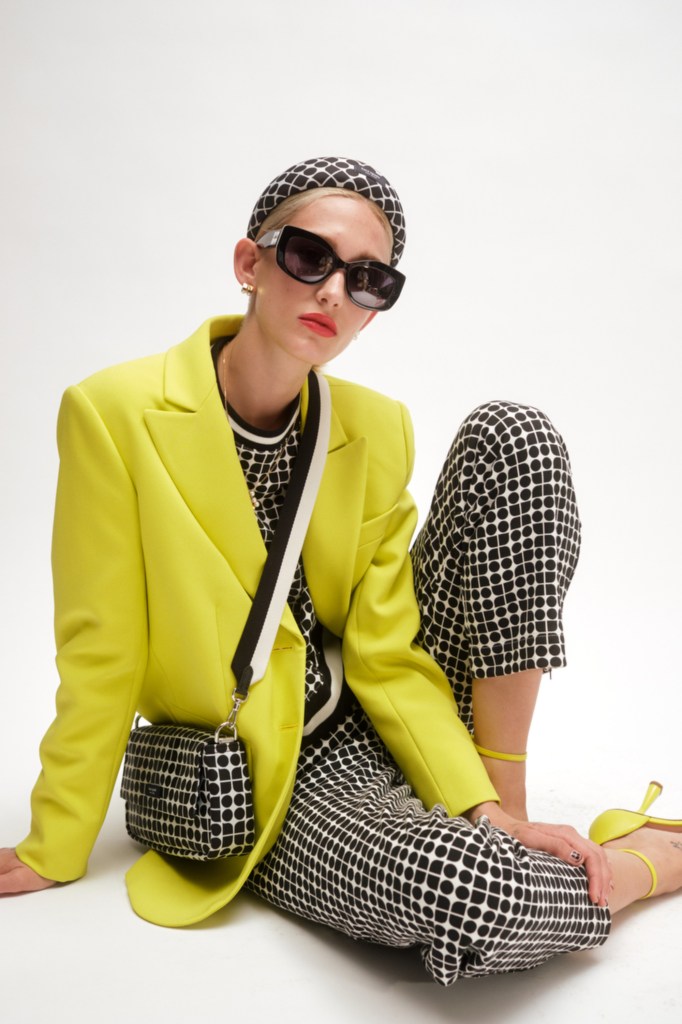Kate Spade RTW Spring 2024, bright yellow jacket, patterned bag.