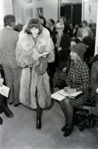 Anna Wintour in a fur coat and guests attend an Yves Saint Laurent haute couture show at his atelier in Paris.