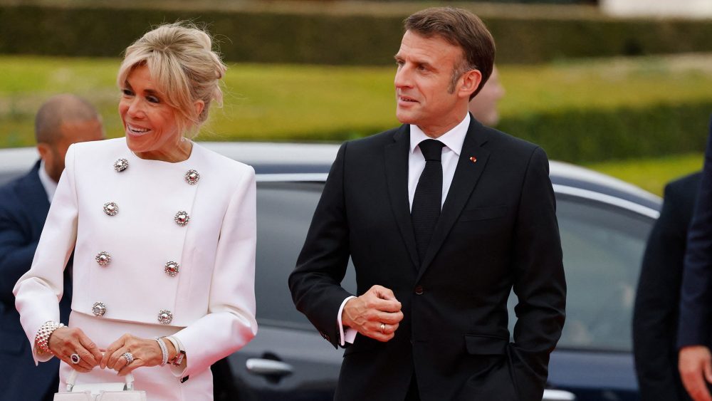 Brigitte Macron and French president Emmanuel Macron at an IOC gala on July 25 in Paris, skirt suit, Louis Vuitton, Capucines