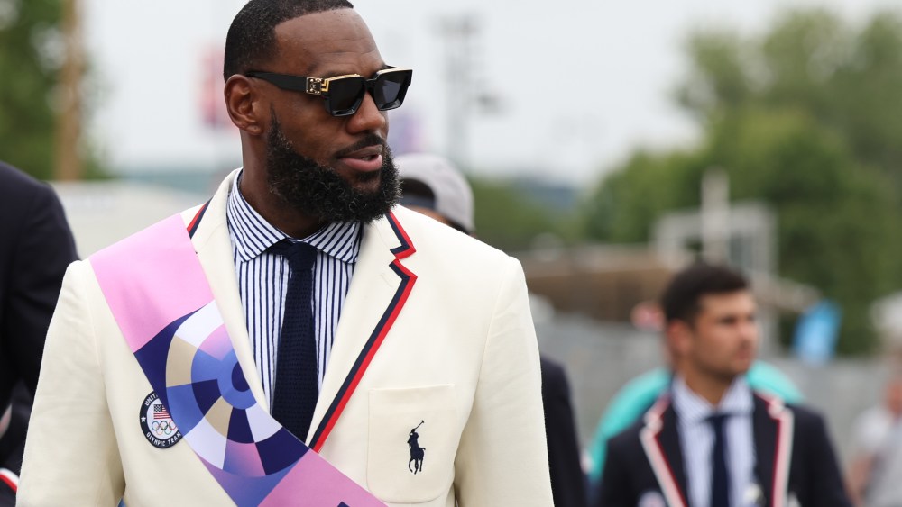 PARIS, FRANCE - JULY 26: LeBron James, flag bearer of Team United States looks on prior to the opening ceremony of the Olympic Games Paris 2024 on July 26, 2024 in Paris, France. (Photo by Quinn Rooney/Getty Images)