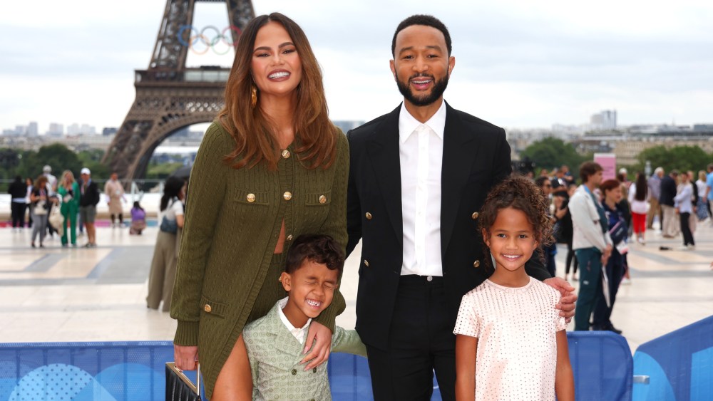 Chrissy Teigen and John Legend with son Miles and daughter Luna on the red carpet ahead of the opening ceremony of the Paris 2024 Olympics.