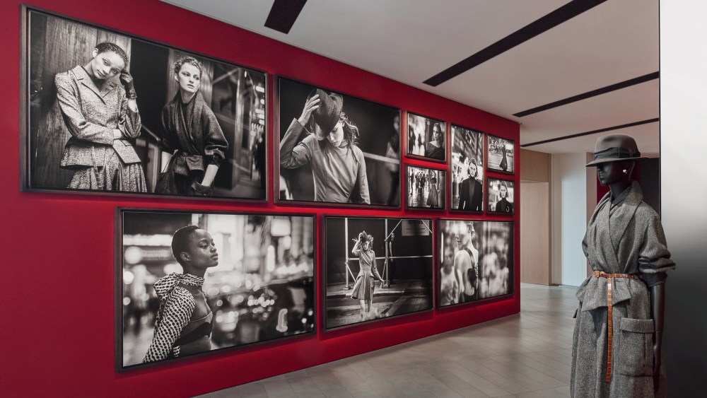 A view of the "Dior/Lindbergh" exhibition at La Galerie Dior in Paris, featuring Dior fashions and Peter Lindbergh photos.