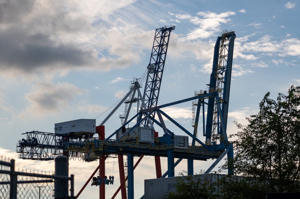 Cranes used for shipping containers rise from the Red Hook Container Terminal in Brooklyn on September 30, 2024 in New York City. A massive strike that could shut down ports across the East and Gulf coasts is all but certain to begin at midnight as members of the International Longshoremen’s Association continue to make salary and other demands to the United States Maritime Alliance, which controls many of the ports across the country.