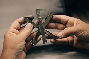 A hammered metal Christogram design by Goossens.