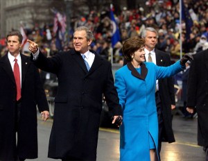 George W. Bush and  his wife Laura walk down Pennsylvania Avenue towards the White House after Bush was sworn in as the United States' 43rd president 20 January 2001 in Washington.