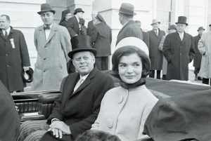 US President John F Kennedy and First Lady Jacqueline Kennedy  leave the capital building by car shortly after the former took the oath of office as President of the United States, Washington DC, January 20, 1961.