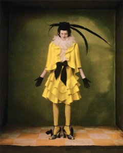 Valentino haute couture shantung gazar jacket and ruffled skirt, organza blouse embroidered with feathers, felt hat with feathers, lace tights, peau de soie sash and Big Bow velvet sandal.