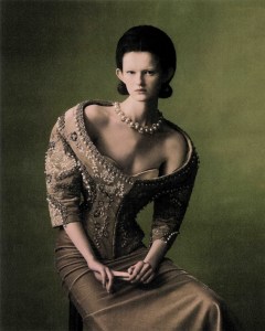 Schiaparelli haute couture off-the-shoulder jacket in stripes of velvet embroidery with rhinestones and pearls, and velvet column skirt. Tiffany & Co.’s Jean Schlumberger by Tiffany pearl twist necklace in 18-karat yellow gold and platinum with South Sea white pearls and diamonds.