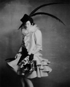 Valentino haute couture shantung gazar jacket and ruffled skirt, organza blouse embroidered with feathers, felt hat with feathers, lace tights, peau de soie sash.