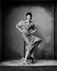 Schiaparelli haute couture off-the-shoulder jacket in stripes of velvet embroidery with rhinestones and pearls, and velvet column skirt. And floral corset canvas heeled sandal with an asymmetrical wavy décolleté.