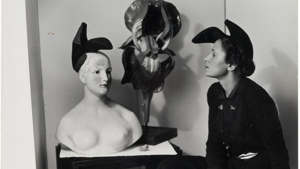 Gala Dali wearing Shoe Hat and LIps jacket, which she inspired that was designed by Elsa Schiaparelli and Salvador Dali.