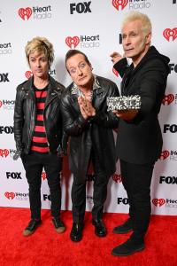 Billie Joe Armstrong, Tré Cool, Mike Dirnt of Green Day at the 2025 iHeartRadio Music Awards held at the Dolby Theatre on March 17, 2025 in Los Angeles, California.
