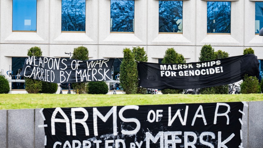Banners hang in front of the headquarters of Danish shipping giant Maersk as Activist stage a demonstration in support of the people in Gaza, in Copenhagen, Denmark, on February 24, 2025. The demonstrators are protesting against the shipping company's transport of military equipment to Israel.