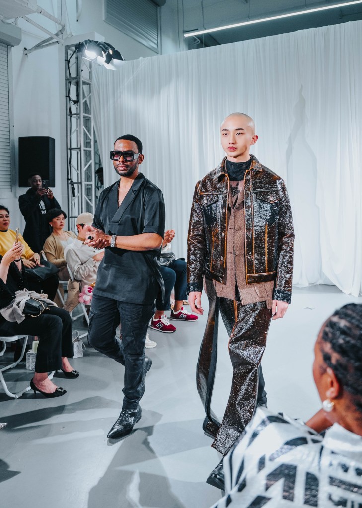David Tlale with a model wearing a look designed by him at Shanghai Fashion Week