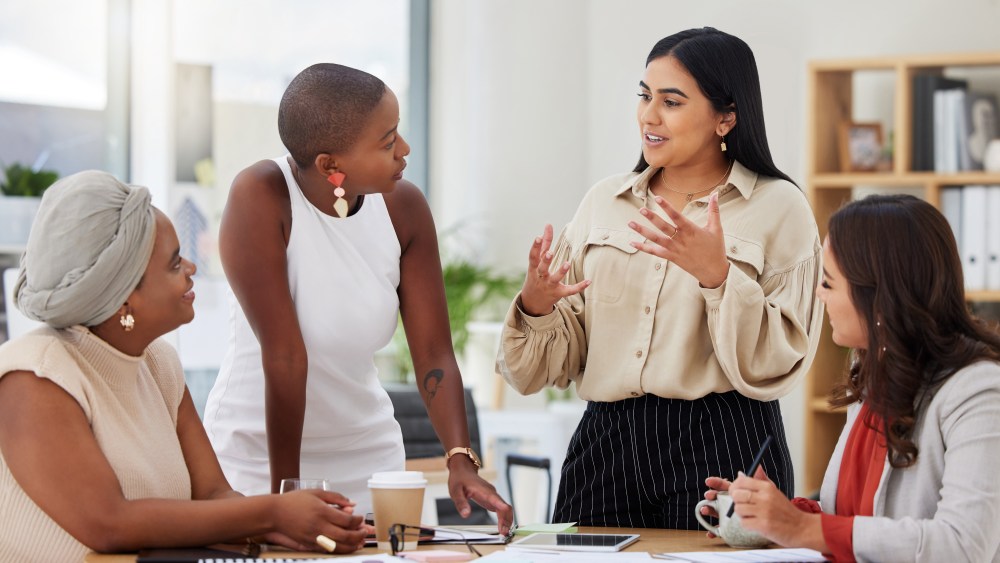 Diverse group, teamwork and young business women brainstorming, collaboration or cooperation. Ambitious confident professional team of colleagues talking and planning a marketing strategy together.