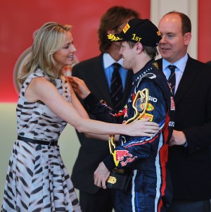 MONTE CARLO, MONACO - MAY 29:  Sebastian Vettel of Germany and Red Bull Racing receives the winners trophy from Prince Albert II of Monaco and his girlfriend Charlene Wittsock after the Monaco Formula One Grand Prix at the Monte Carlo Circuit on May 29, 2011 in Monte Carlo, Monaco.  (Photo by Paul Gilham/Getty Images)