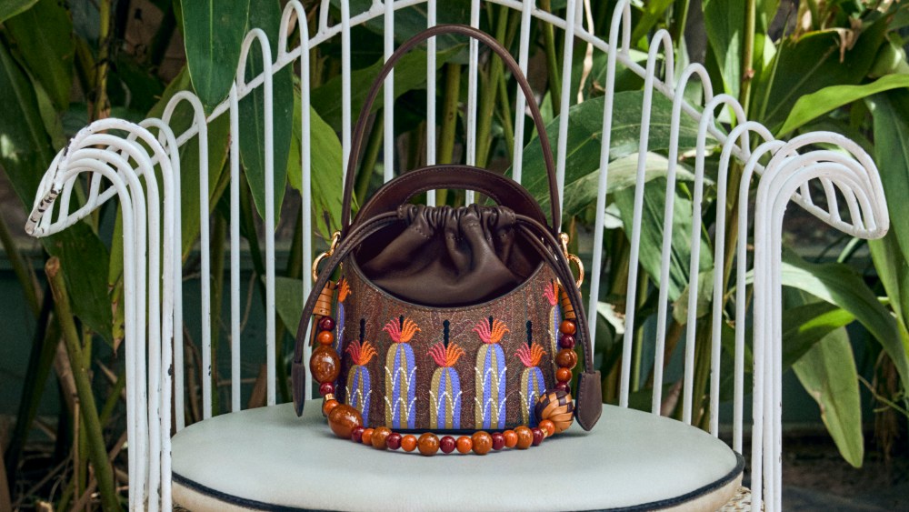 Etro's Saturno bag reinterpreted by artist Agostino Iacurci for summer 2025.