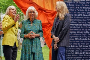 LONDON, ENGLAND - JUNE 11: Britain's Queen Camilla, centre, listens to author Kate Mosse, left, as she attends the Women's Prize for Fiction and Nonfiction event  on June 11, 2025 in London, England. (Photo by Alberto Pezzali - WPA Pool/Getty Images)