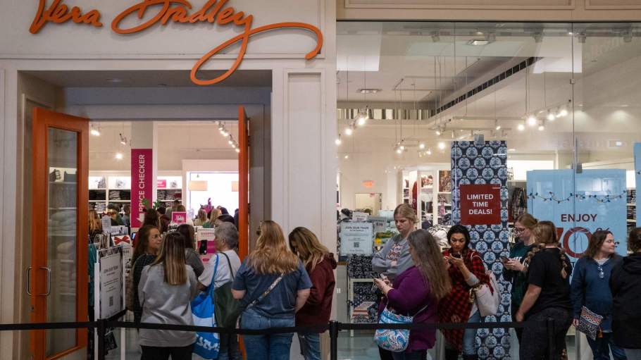 Black Friday shoppers wait to enter the Vera Bradley store at the Opry Mills Mall in Nashville, Tennessee, on November 25, 2022.