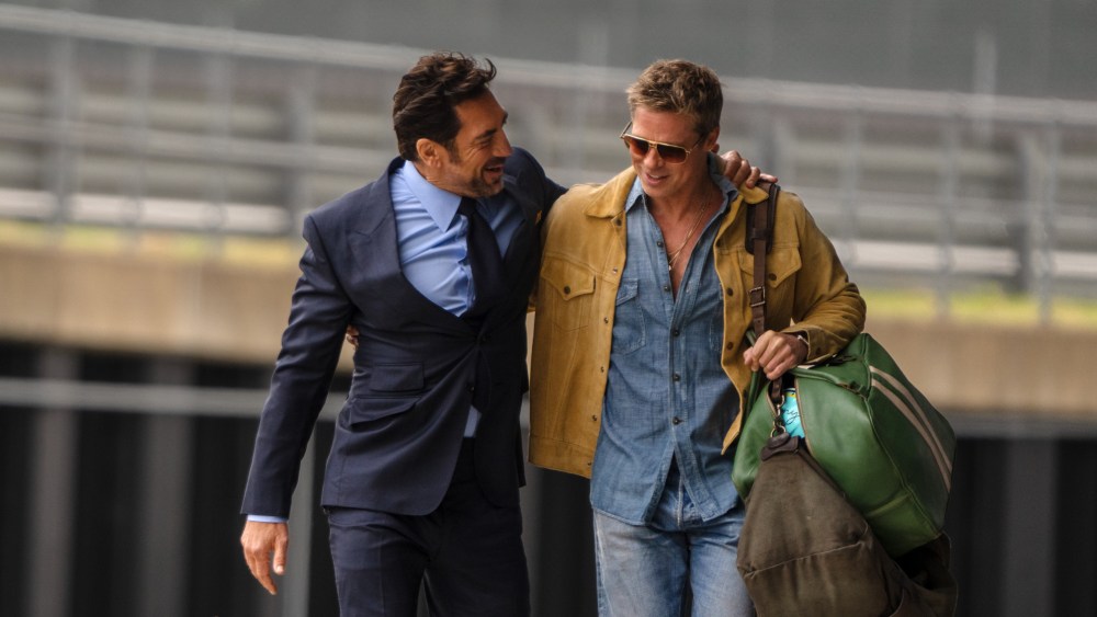 JAVIER BARDEM as Ruben Cervantes and BRAD PITT as Sonny Hayes in Apple Original Films’ “F1® The Movie,” a Warner Bros. Pictures release.