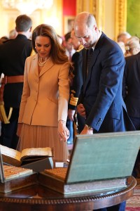 WINDSOR, ENGLAND - JULY 8: Prince William, Prince of Wales and Catherine, Princess of Wales view items on display during the President of France and his wife's visit to the Royal Collection exhibition, in the Green Drawing Room at Windsor Castle on July 8, 2025 in Windsor, England. President Emmanuel Macron and Mrs Brigitte Macron visit the UK in the first visit State Visit made by France in 17 years. They are staying at Windsor Castle, hosted by King Charles III and Queen Camilla, and a banquet will be held there in their honour. The Macrons will visit Imperial College, and the President will address Parliament during his stay.  (Photo by Aaron Chown - WPA Pool/Getty Images)