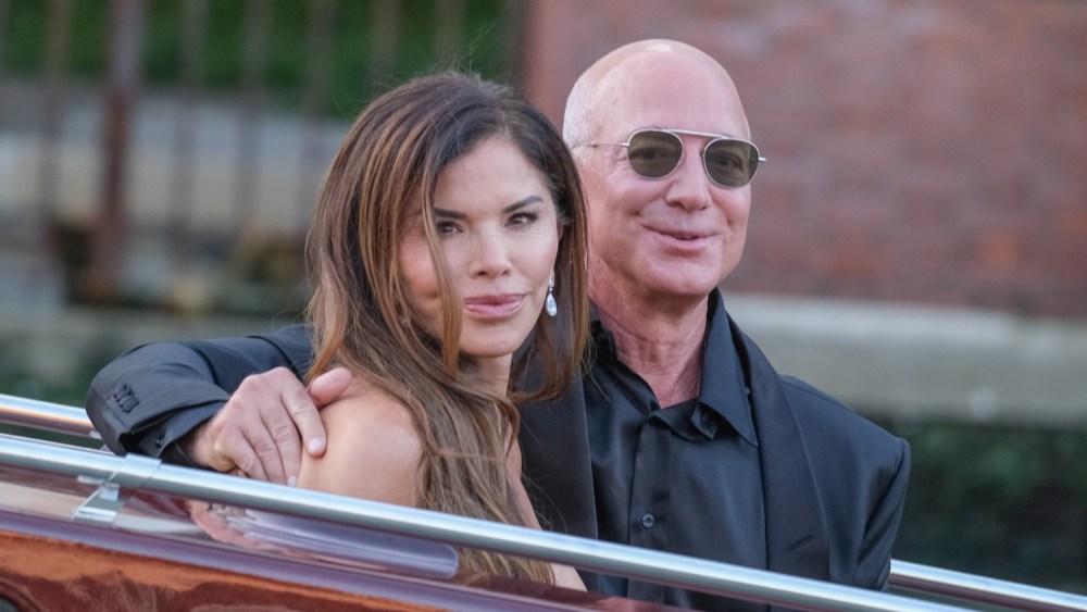 VENICE, ITALY - JUNE 28: Jeff Bezos and Lauren Sanchez are seen leaving the Aman Hotel for a party at the Arsenale on June 28, 2025 in Venice, Italy. (Photo by Stefano Mazzola/GC Images)