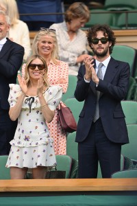 LONDON, ENGLAND - JULY 08: Sienna Miller and Oli Green react to the action court-side on day nine of the Wimbledon Tennis Championships at the All England Lawn Tennis and Croquet Club on July 08, 2025 in London, England. (Photo by Karwai Tang/WireImage)