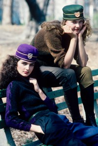 Models Eva Voorhies and Lisa Ryall in belted sweaters, two-toned knickers and felt, crested pillbox hats from Perry Ellis' Fall 1981 RTW collection.