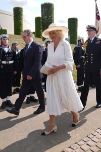 ALREWAS, ENGLAND - AUGUST 15: Prime Minister Sir Keir Starmer and Queen Camilla arrive for the national Service of Remembrance, hosted by the Royal British Legion in partnership with the Government, to mark the 80th Anniversary of VJ Day at the National Memorial Arboretum in Alrewas on August 15, 2025, In Alrewas, England. The service commemorates the 80th Anniversary of Victory over Japan Day, or VJ Day, which marks the announcement of Japan's acceptance of the terms of the Potsdam Declaration on August 15, 1945, effectively bringing WWII to an end. (Photo by Joe Giddens - WPA Pool/Getty Images)