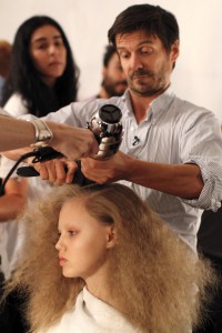 Hairstylist Guido Palau prepares backstage at the Marc Jacobs spring 2011 runway show at the New York State Armory.