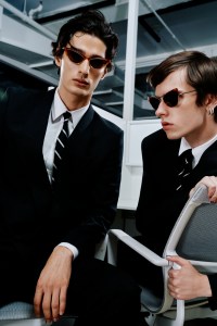 Addison (L): Bottega Veneta recycled acetate, bio nylon sunglasses; Gucci wool jacket; Emporio Armani cotton shirt and wool pants; Brooks Brothers tie; Ralph Lauren Purple Label shoes.Brunson (R): Max Mara metal and acetate sunglasses; Ralph Lauren Purple Label jacket, pants and tie; Emporio Armani wool jacket; Gucci cotton shirt; Scarosso shoes.