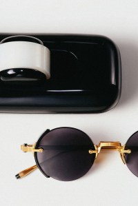 Akoni Eyewear japanese titanium, rimless structure enriched with acetate side shield sunglasses.