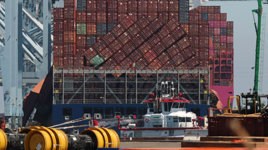 Fallen shipping containers are seen next to stacks of leaning containers on a vessel moored at the Port of Long Beach in Long Beach, California, on September 9, 2025.