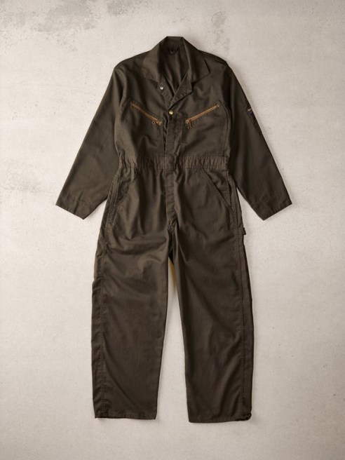 An adult 1960s flight jumpsuit is included in the collection.