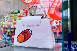 The Louis Vuitton stand at Art Basel Paris featuring artworks and handbag designs by Takashi Murakami.