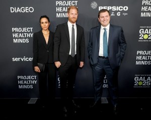 NEW YORK, NEW YORK - OCTOBER 09: (L-R) Meghan, Duchess of Sussex, Prince Harry, Duke of Sussex, and Phil Schermer attend the Project Healthy Minds World Mental Health Day Gala at Spring Studios on October 09, 2025 in New York City. (Photo by Rob Kim/Getty Images for Project Healthy Minds)