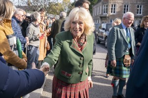 BALLATER, SCOTLAND - OCTOBER 9: Queen Camilla meets members of the public during a visit to mark the 150th anniversary of The Albert Hall in Aberdeenshire on October 9, 2025 in Ballater, Scotland. (Photo by Jane Barlow - Pool/Getty Images)