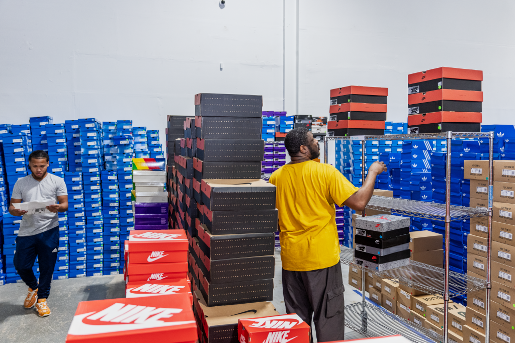 OS Group employees fulfilling orders in the warehouse.