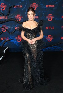 Millie Bobby Brown at the "Stranger Things" Season 5 World Premiere held at the TCL Chinese Theatre on November 06, 2025 in Los Angeles, California.