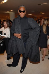 Andre Leon Talley made a dramatic entrance at the Balenciaga Paris party at Barneys New York on September 8, 2006, wearing a black Nicholas Ghesquire for Balenciaga cape and custom black rhinestone-buckled Roger Vivier evening shoes.