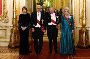 WINDSOR, ENGLAND - DECEMBER 03: King Charles III (2R) and Queen Camilla (R) pose with German President Frank-Walter Steinmeier and his wife Elke Budenbender ahead of the state banquet for the German President and his wife, on day one of their state visit to the UK, at Windsor Castle on December 3, 2025 in Windsor, England. The President of the Federal Republic of Germany, accompanied by Ms. Elke Büdenbender, are paying a State Visit to the United Kingdom as the guests of Their Majesties The King and Queen. The visit is the first from Germany in 27 years and will be marked with ceremonial visits, an address to the UK parliament and a banquet. (Photo by Aaron Chown - Pool/Getty Images)