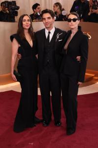 Lucia Aniello, Paul W. Downs and Jen Statsky at the 83rd Annual Golden Globes held at The Beverly Hilton on January 11, 2026 in Beverly Hills, California.