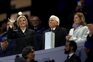 Kirsty Coventry, President of the IOC, and Sergio Mattarella, President of Italy, wave during the opening ceremony of the Milano Cortina 2026 Winter Olympics.