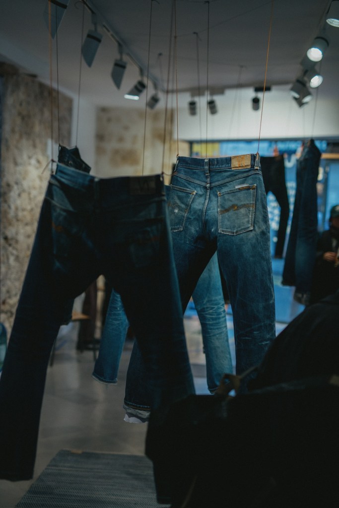 A display of denim inside Nudie Jeans space.